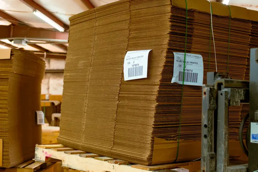 Banded bundles of corrugated sheets in the warehouse
